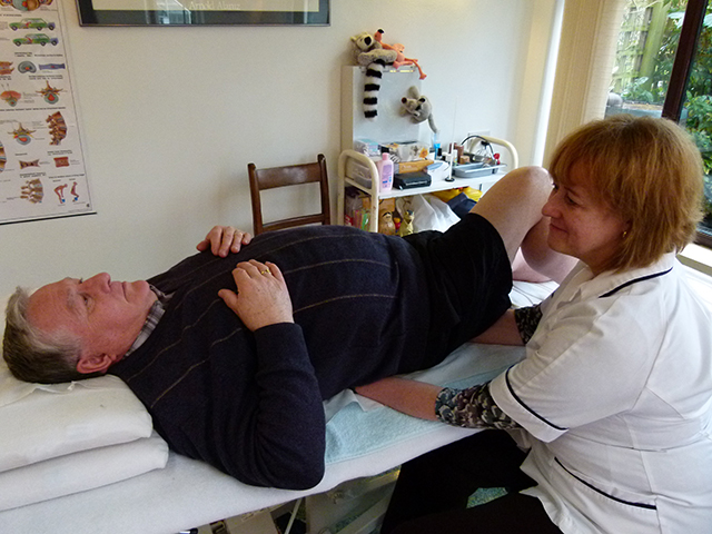 Caroline treating a patient