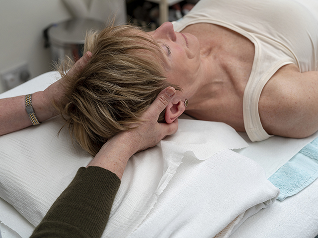 Caroline treating a patient