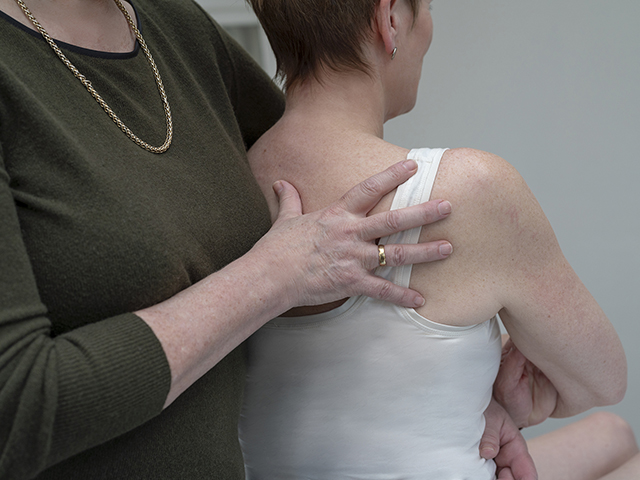 Caroline treating a patient